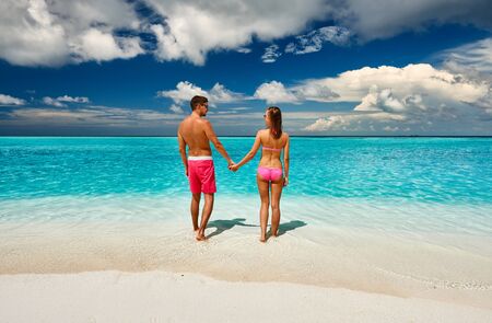 Couple on a tropical beach at Maldivesの写真素材