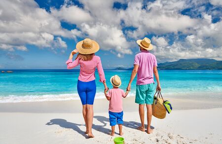 Family on beautiful Anse Soleil beach, young couple with three year old toddler boy. Summer vacation at Seychelles, Mahe.の写真素材