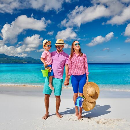 Family on beautiful Anse Soleil beach, young couple with three year old toddler boy. Summer vacation at Seychelles, Mahe.の写真素材