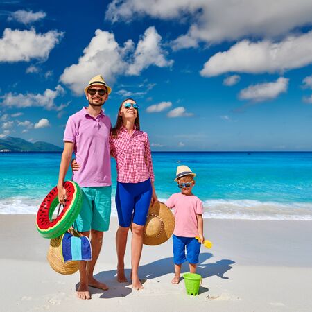 Family on beautiful Anse Soleil beach, young couple with three year old toddler boy. Summer vacation at Seychelles, Mahe.の写真素材