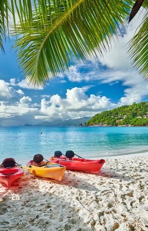 Beautiful Petite Anse beach with kayaks and palm tree at Seychelles, Maheの写真素材