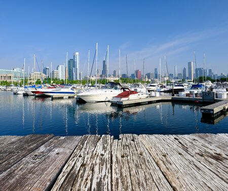 Chicago skyline in the morning with urban marina in front and old wooden pierの写真素材
