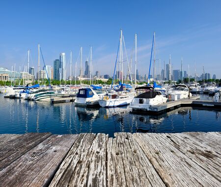 Chicago skyline in the morning with urban marina in front and old wooden pierの写真素材