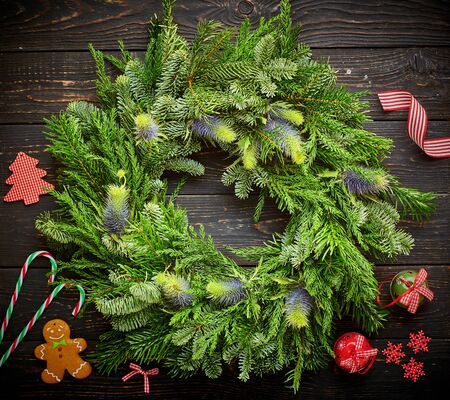 Christmas wreath on dark rustic wooden backgroundの写真素材