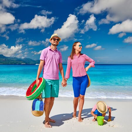 Family on beautiful Anse Soleil beach, young couple with three year old toddler boy. Summer vacation at Seychelles, Mahe.の写真素材
