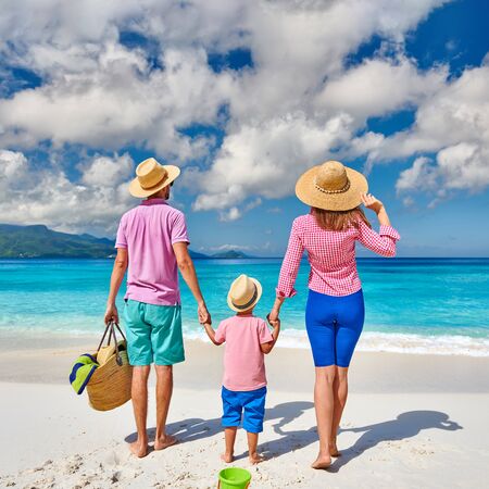 Family on beautiful Anse Soleil beach, young couple with three year old toddler boy. Summer vacation at Seychelles, Mahe.の写真素材