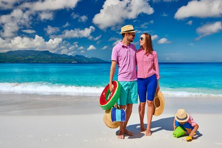 Family on beautiful Anse Soleil beach, young couple with three year old toddler boy. Summer vacation at Seychelles, Mahe.の写真素材