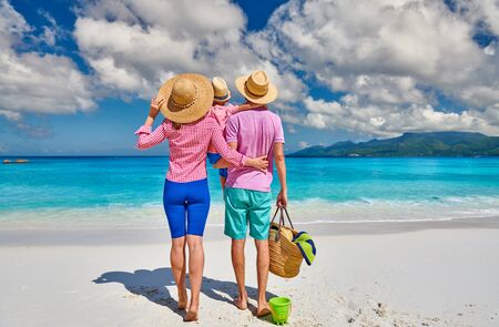 Family on beautiful Anse Soleil beach, young couple with three year old toddler boy. Summer vacation at Seychelles, Mahe.の写真素材