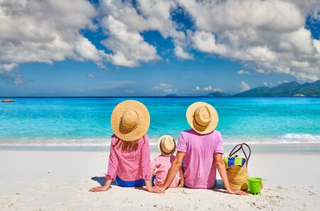 Family on beautiful Anse Soleil beach, young couple with three year old toddler boy. Summer vacation at Seychelles, Mahe.の写真素材