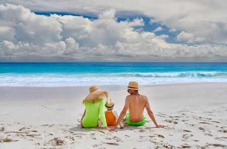 Family on beach, young couple with three year old boy. Summer vacation at Seychelles.の写真素材