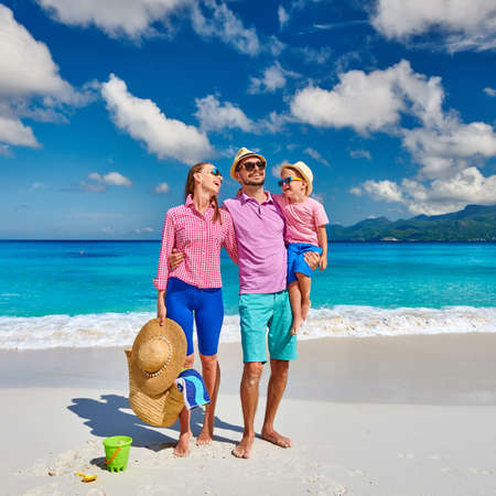 Family on beautiful Anse Soleil beach, young couple with three year old toddler boy. Summer vacation at Seychelles, Mahe.の写真素材