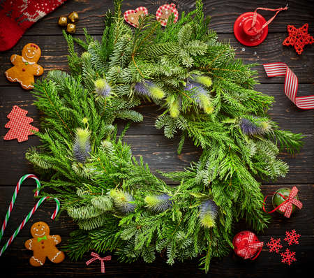 Christmas wreath on dark rustic wooden backgroundの写真素材