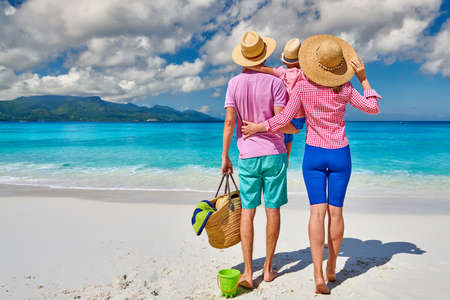 Family on beautiful Anse Soleil beach, young couple with three year old toddler boy. Summer vacation at Seychelles, Mahe.の写真素材