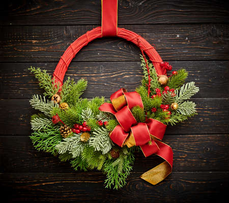 Christmas wreath on dark rustic wooden backgroundの写真素材