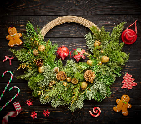 Christmas wreath on dark rustic wooden backgroundの写真素材