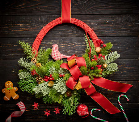 Christmas wreath on dark rustic wooden backgroundの写真素材