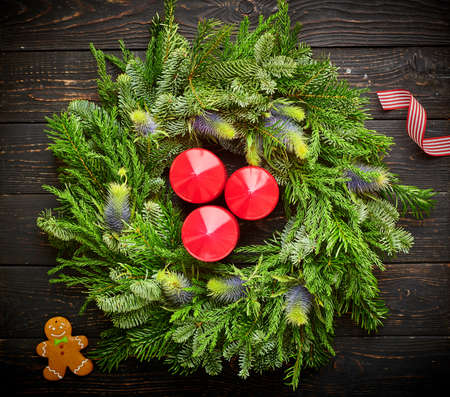 Christmas wreath on dark rustic wooden backgroundの写真素材
