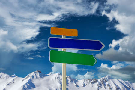 Alpine winter mountain landscape with arrow signs. French Alps covered with snow in sunny day. Val-d'Isere, Alps, Franceの写真素材