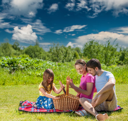 Family on picnic at sunny dayの写真素材