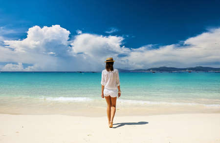 Woman in hat at beach