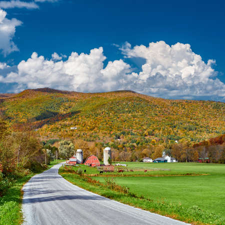 Farm with red barn and silos at sunny autumn day in West Arlington, Vermont, USAの写真素材