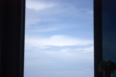 blue sky and white clouds on the window in the morning, background