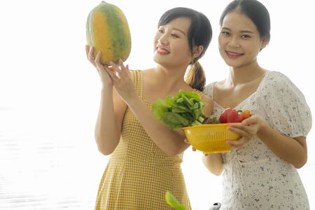 2 girls cookingの写真素材