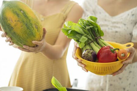 2 girls cookingの写真素材