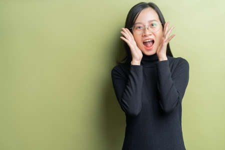 Image of asian woman in black is screamingの写真素材