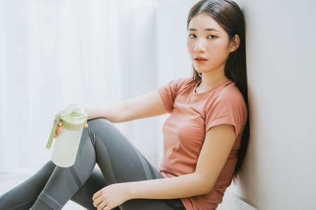 Asian woman is resting after yogaの写真素材