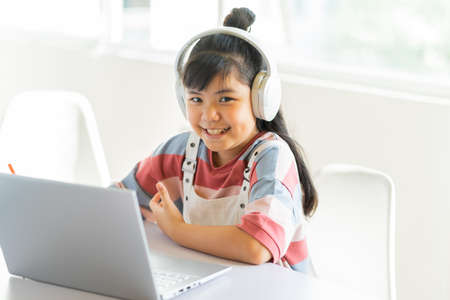 Asian girls studying online at homeの写真素材