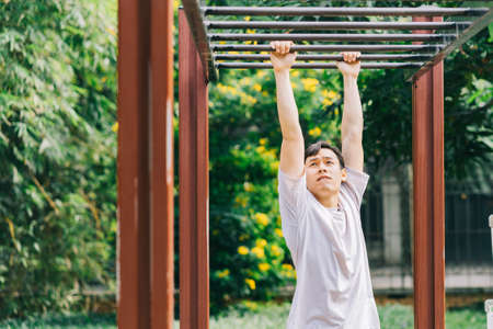 Asian man exercising in parkの写真素材