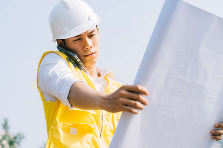 Asian construction engineers are doing experimental tests at the siteの写真素材