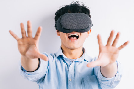 the man is experiencing the virtual reality glassesの写真素材