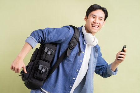 Several Asian students are running while holding smartphones in hand