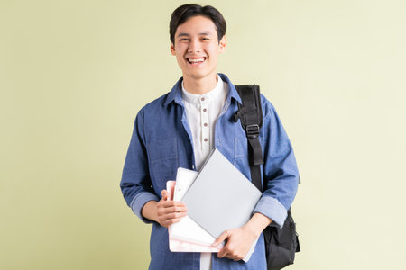 A photo of a handsome Asian student with a confident lookの写真素材
