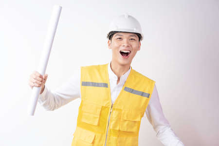 Portrait of male construction engineer with expression on white backgroundの写真素材