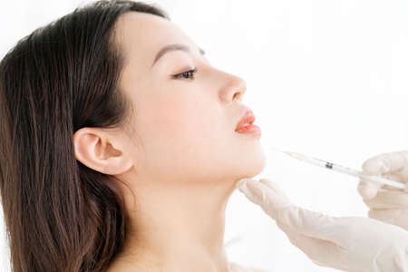 Asian woman undergoing fine carpet surgery