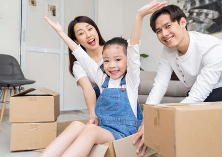Young Asian families are moving into a new home togetherの写真素材