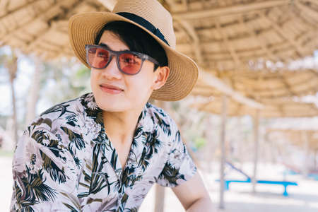 Portrait of Asian man on the beachの写真素材