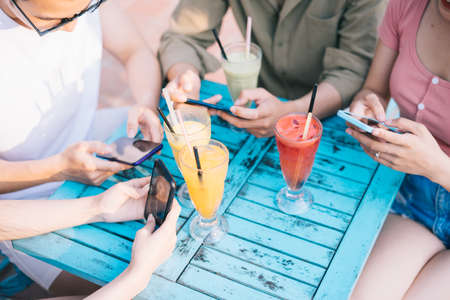 A group of young Asians enjoy a trip to the sea on a summer vacation
