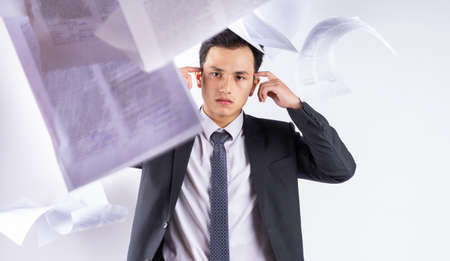 Stressed Asian businessman on white backgroundの写真素材
