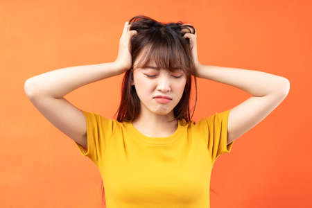 Image of young Asian girl on blue background