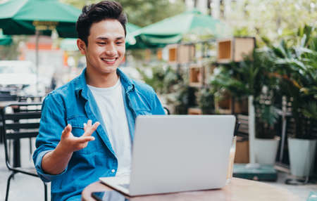Young Asian man working at coffee shop