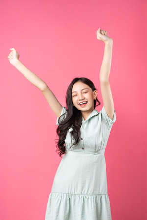 Young Asian woman with victory expressionの写真素材