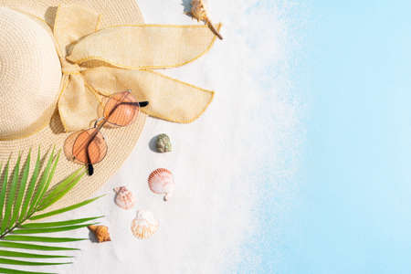 Summer background with hat, sunglasses, sand and seashell
