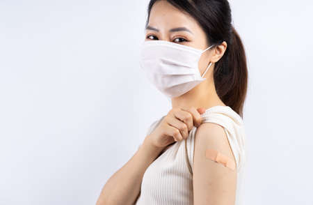 Asians get vaccinated against covid 19の写真素材