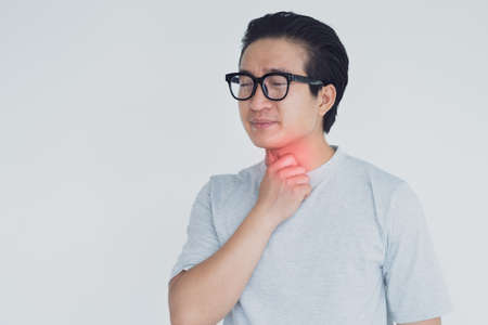 photo of Asian man with neck joint painの写真素材