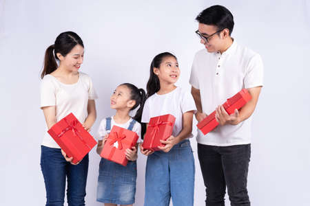 Portrait of Asian family on white backgroundの写真素材
