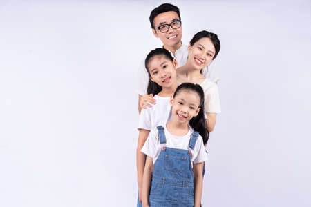 Portrait of Asian family on white backgroundの写真素材